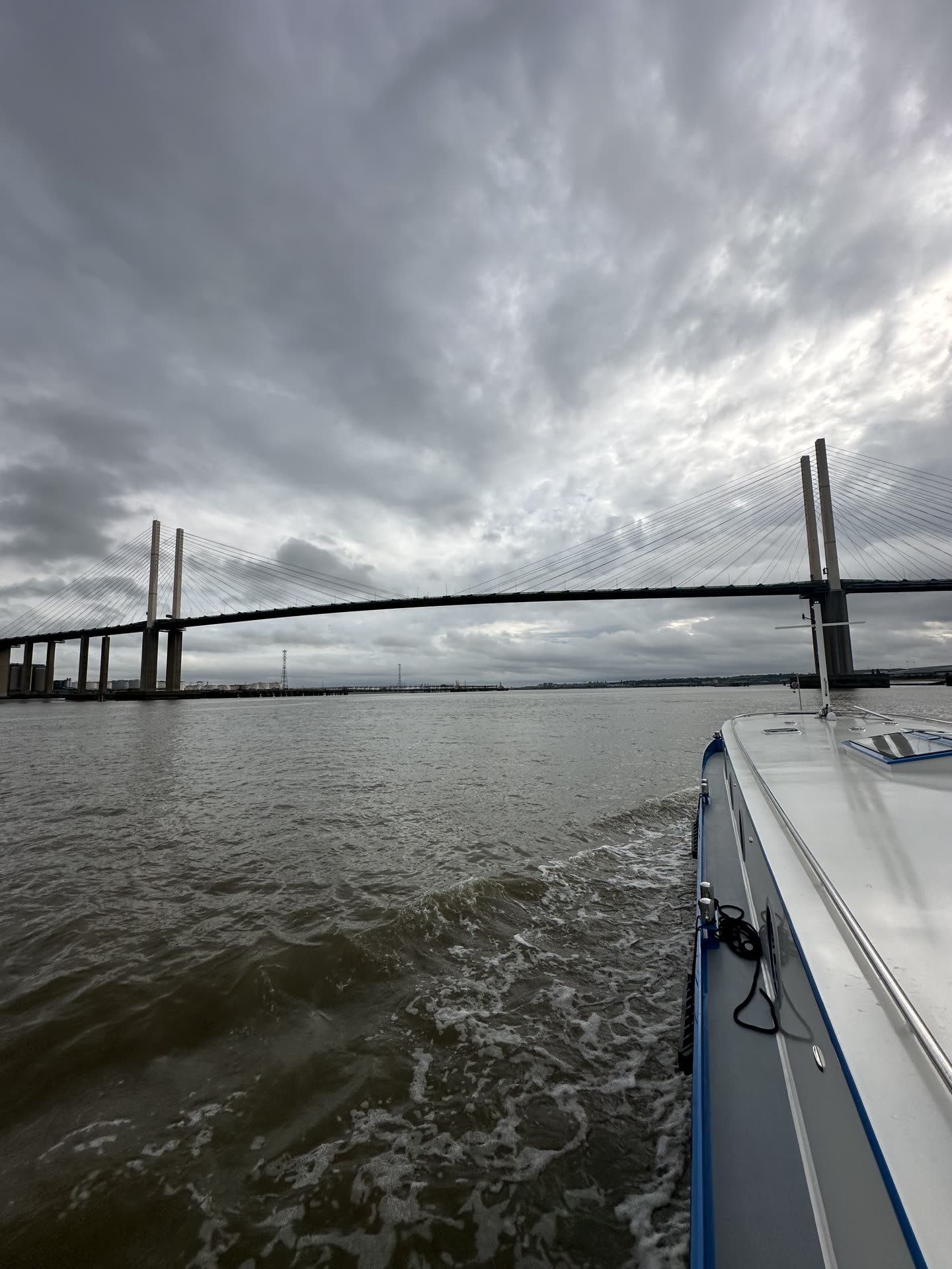 The Queen Elizabeth II Bridge at Dartford under a grey sky, seen from the deck