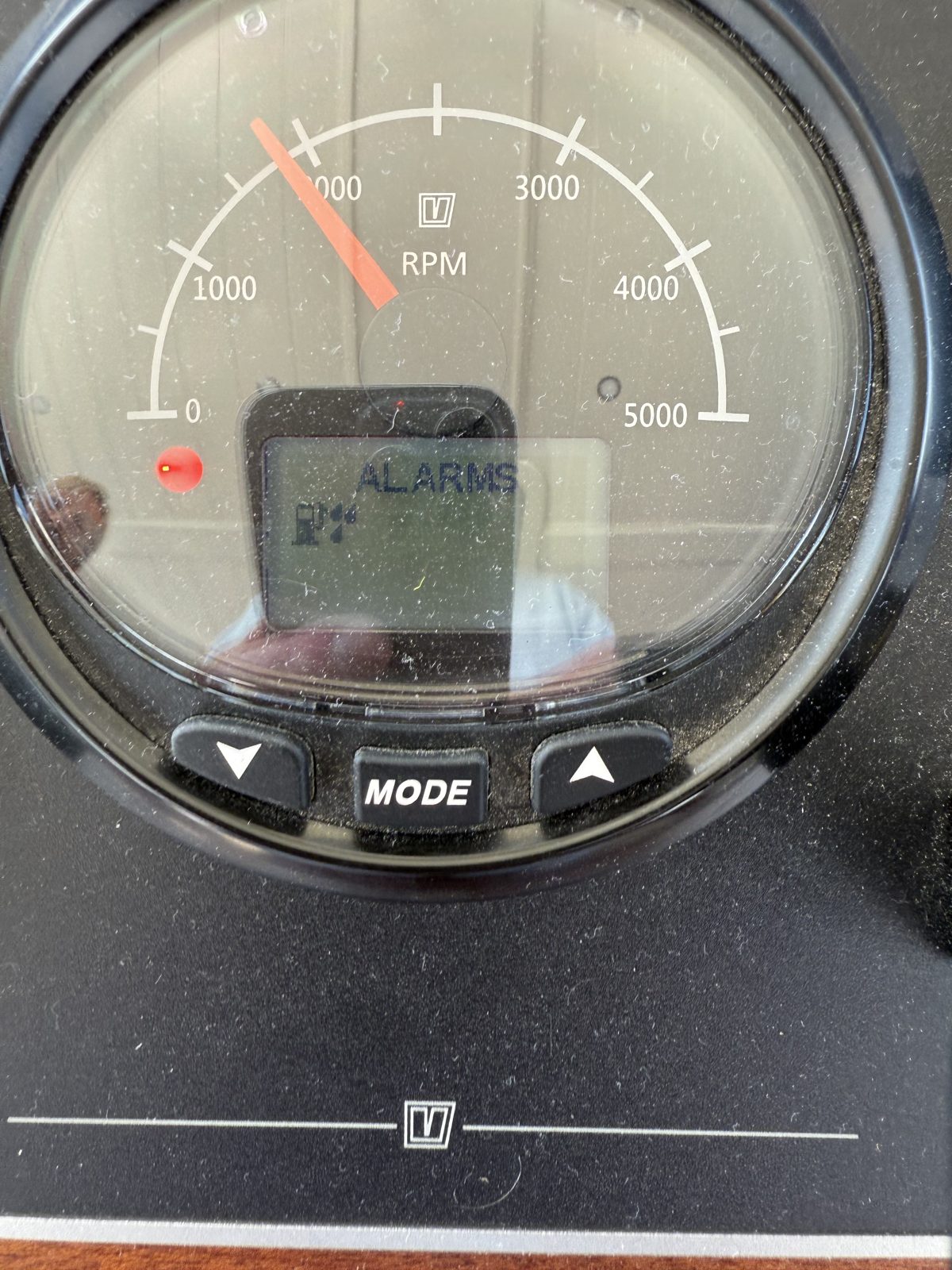 The engine dashboard showing the water in fuel alarm