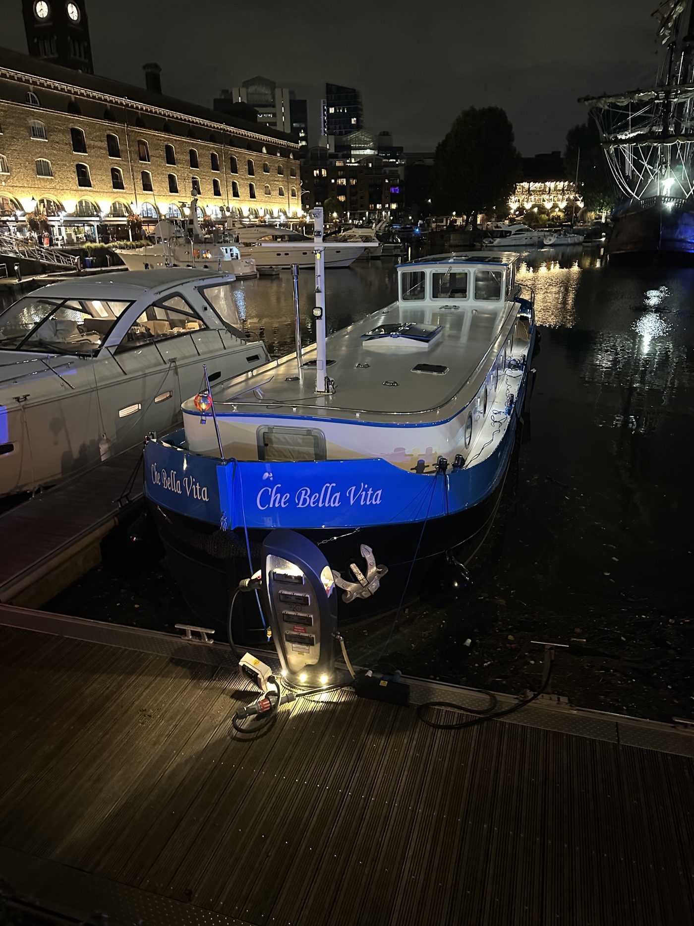 Che Bella Vita moored at night in St Katharine Docks